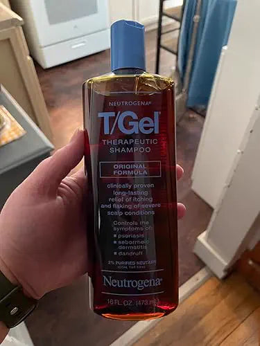 T/Gel Original Formula bottle held in hand