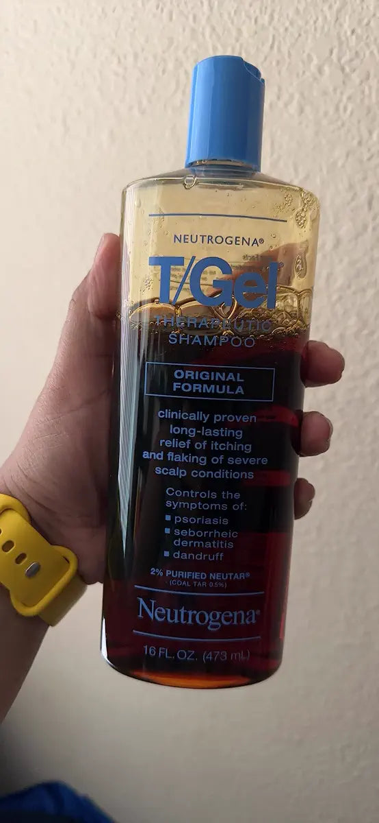 T/Gel bottle held upright against a light wall