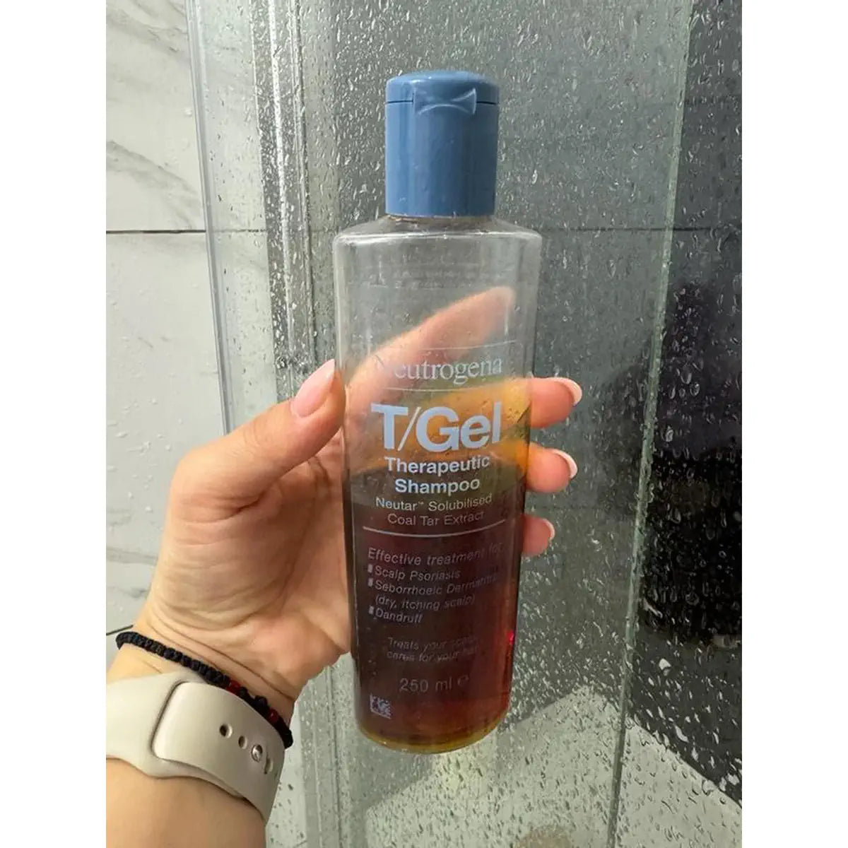 T/Gel bottle held in a shower