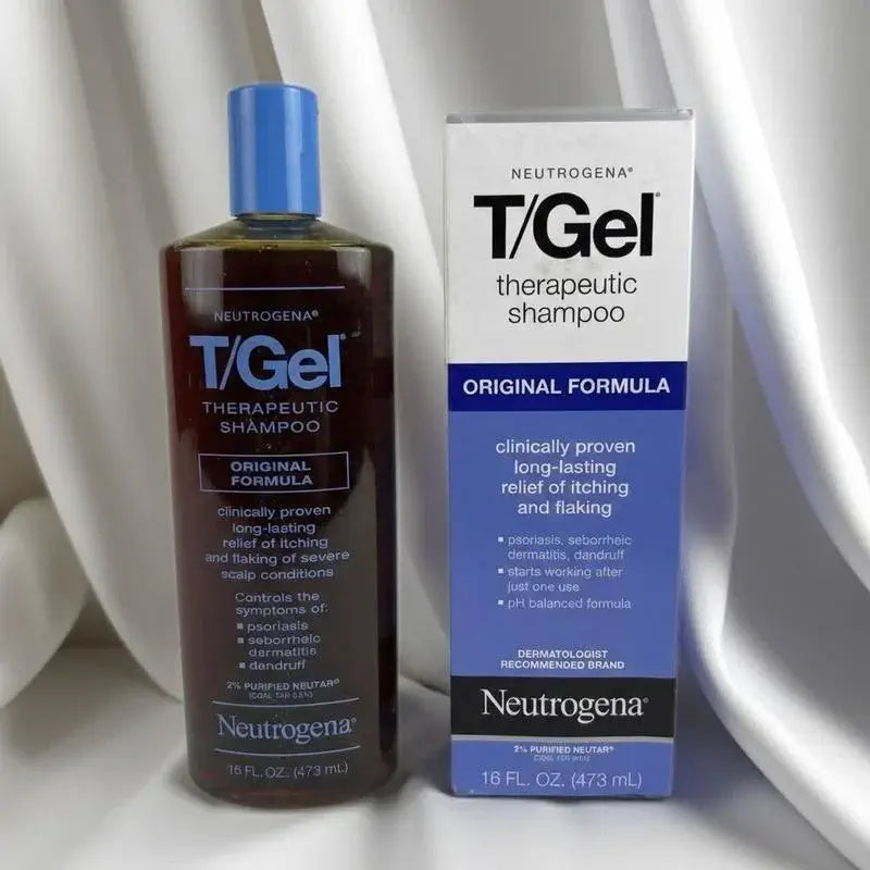 T/Gel bottle and carton arranged on light fabric