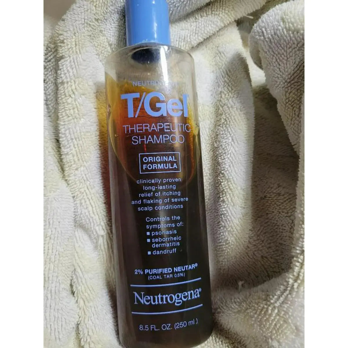 T/Gel bottle standing on soft gray fabric